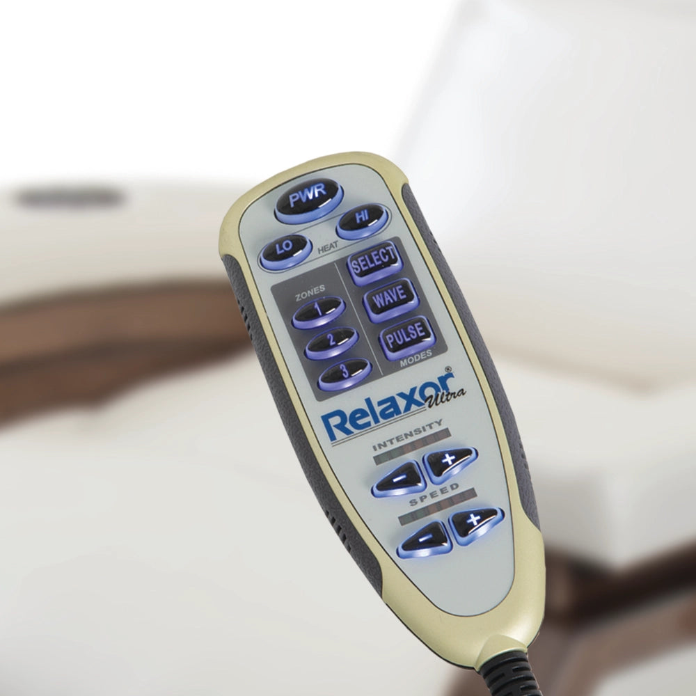 Relaxor handheld massage control beside a Living Earth Crafts ZG Dream lounger