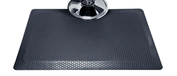 Nickels Worth textured rectangular salon and barber mat around a chair base