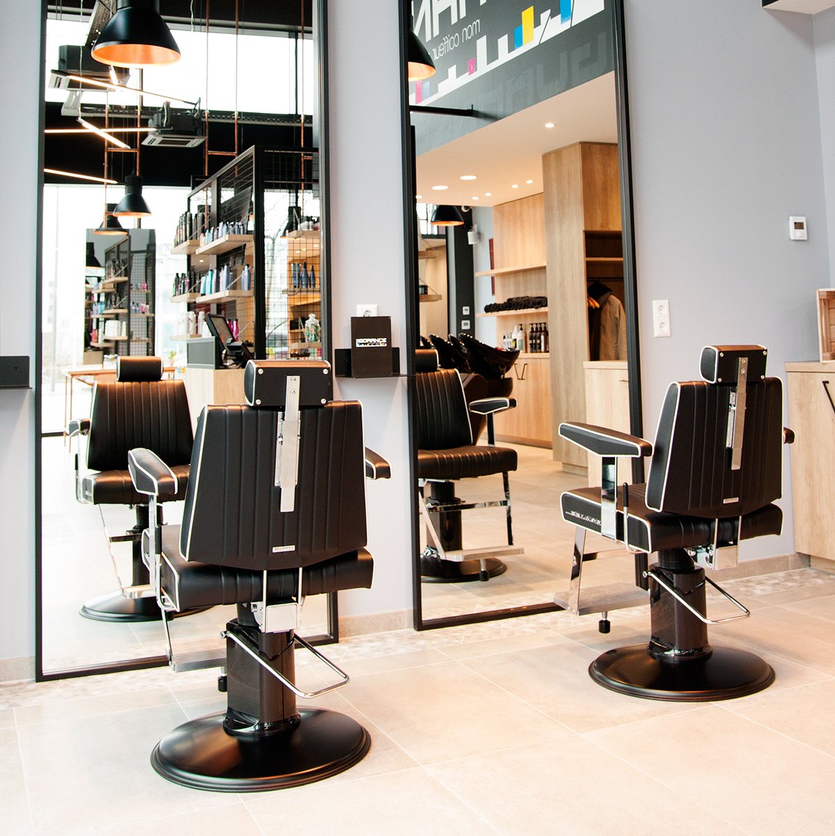 Takara Belmont Dainty barber chairs at barbershop stations, viewed from behind