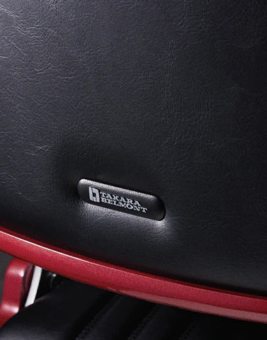 Takara Belmont badge on the black backrest of the Legacy 100 Vintage Stripe barber chair