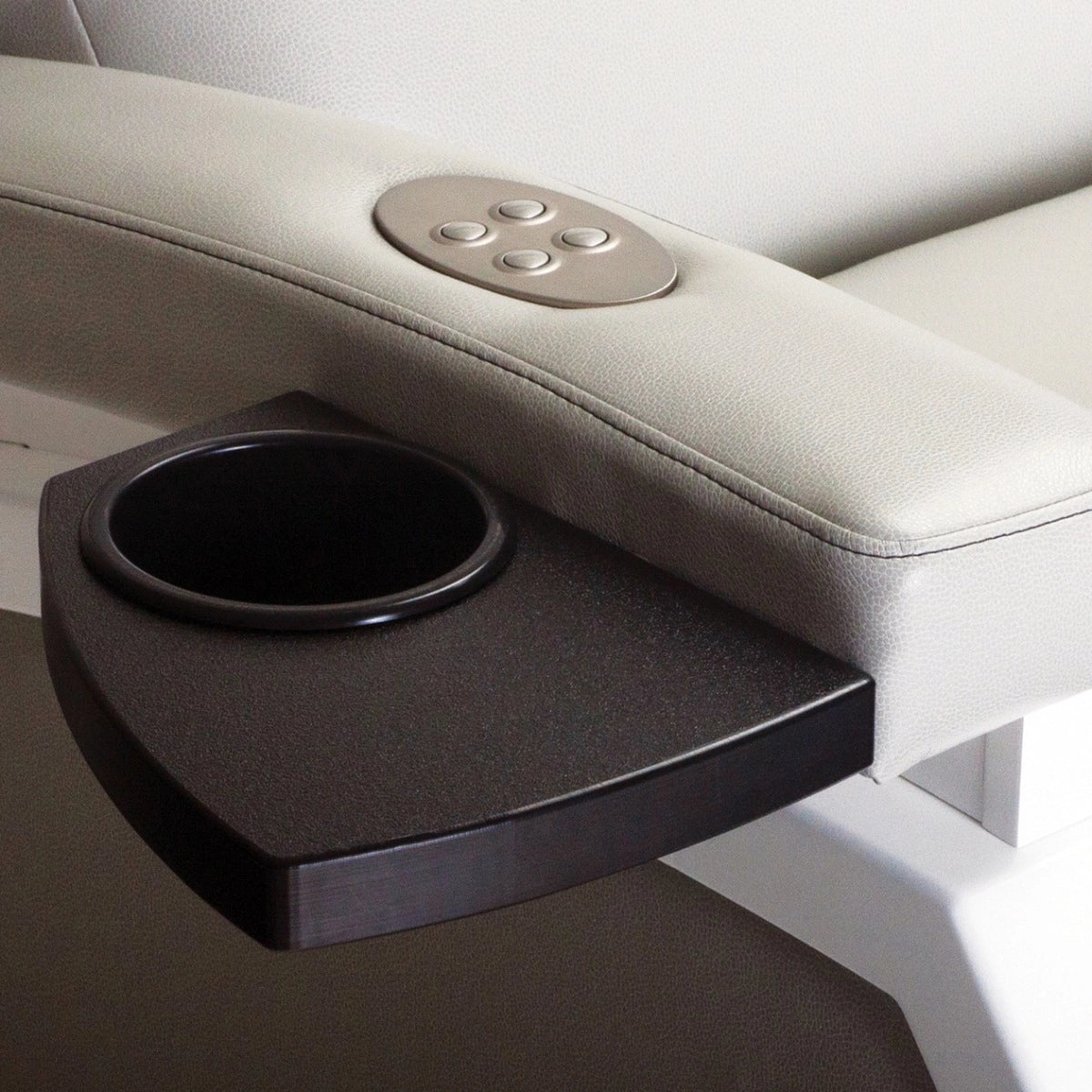 Close-up of the ZG Dream lounger arm controls and attached cup holder