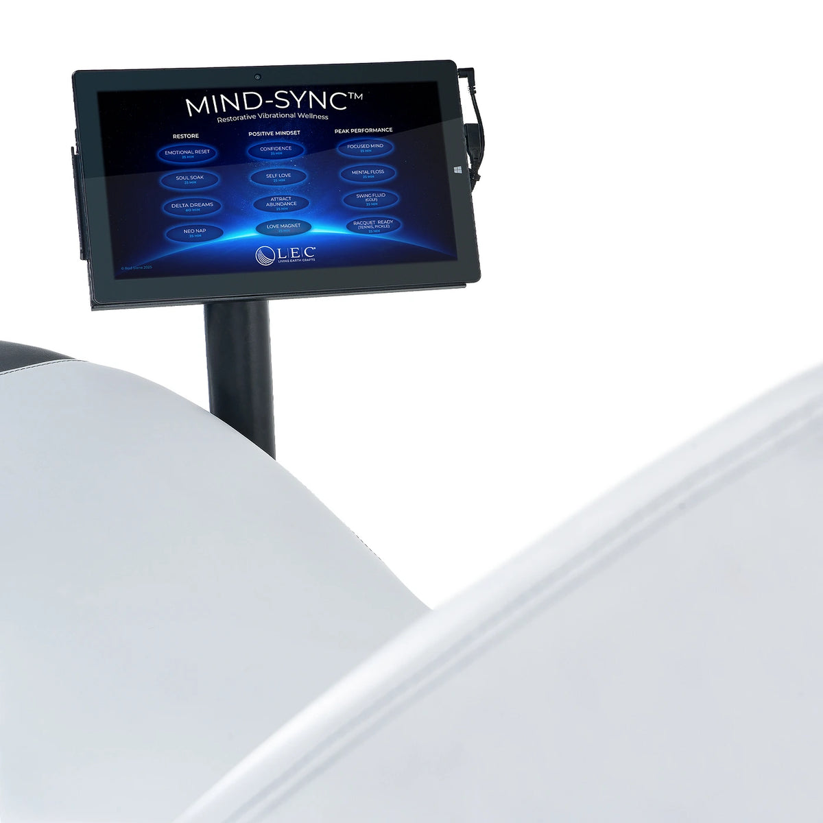 Close-up of the Mind-Sync touchscreen mounted beside a wellness lounger