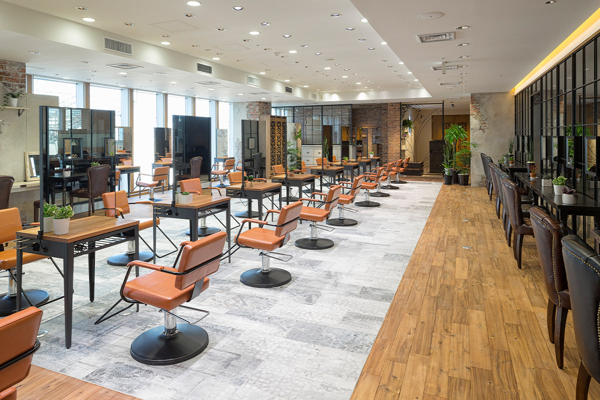 Takara Belmont Shiki styling chairs at mirror stations in a spacious salon