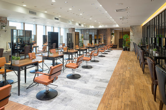 Takara Belmont Shiki styling chairs at mirror stations in a spacious salon