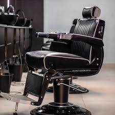 Takara Belmont 225 Elite Black Elegance barber chair at a barbershop station
