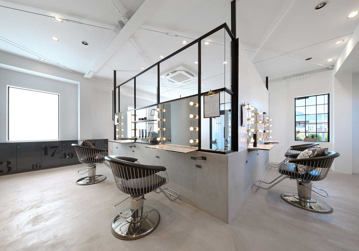 Takara Belmont Harp styling chairs around a central salon workstation