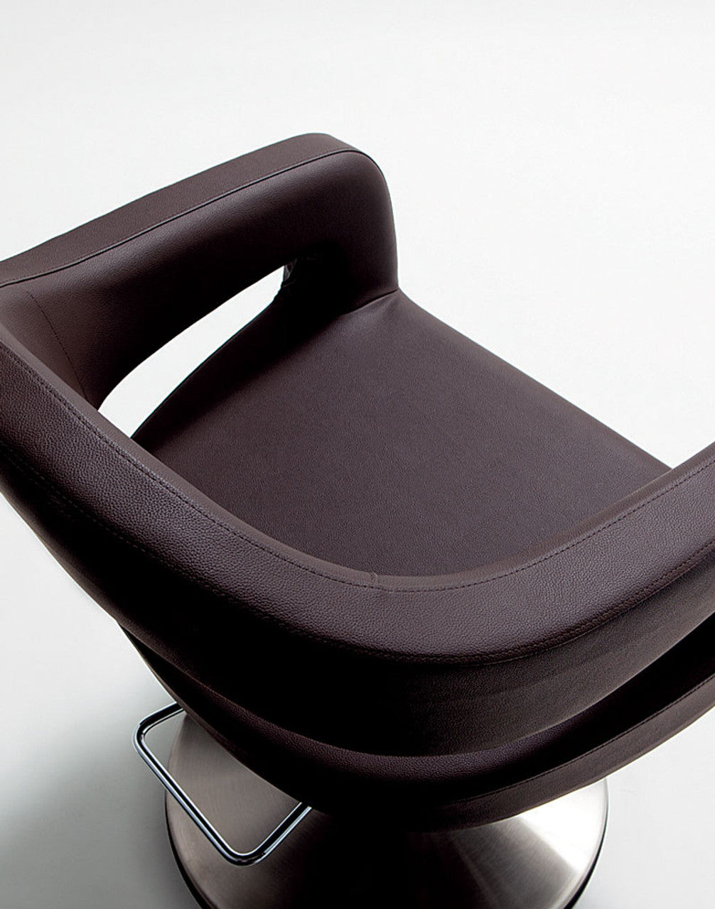 Takara Belmont Knoll styling chair seat, curved armrest and open-back detail
