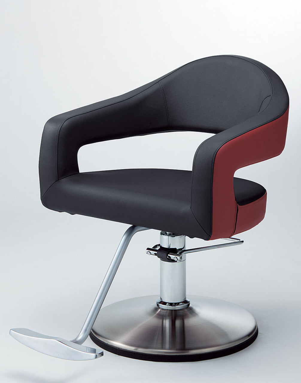 Takara Belmont Knoll styling chair with black and red upholstery and a round chrome base