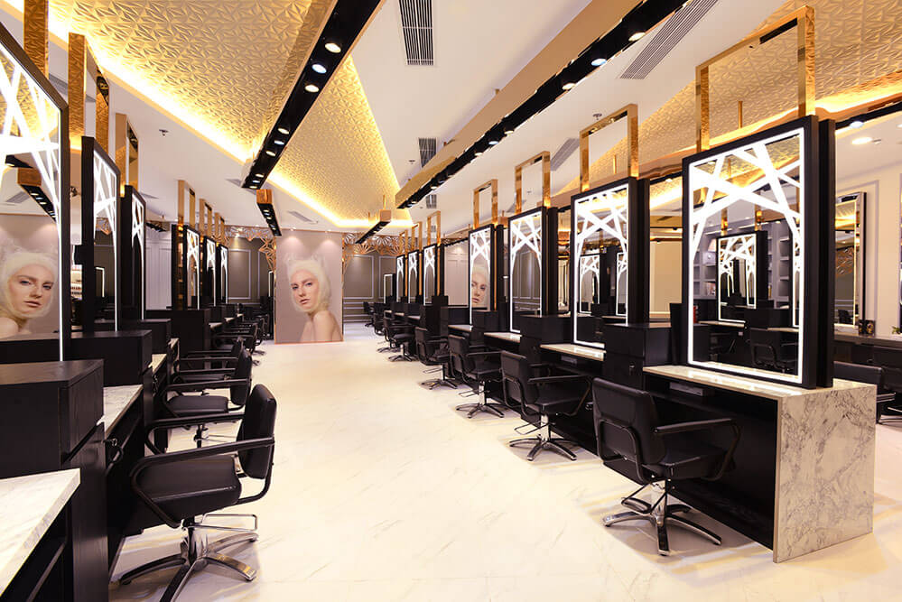 Salon interior with Takara Belmont Prime styling chairs and illuminated mirror stations