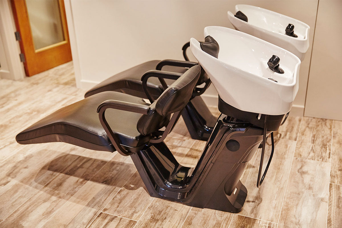 Two Takara Belmont RS Elite shampoo units with white bowls and brown bases