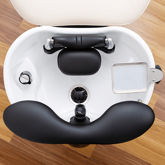 Overhead view of the YUME lash device, pillow and accessory tray fitted to a shampoo bowl