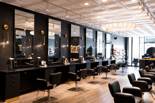 Takara Belmont Bellus chairs at black mirrored stations in a salon
