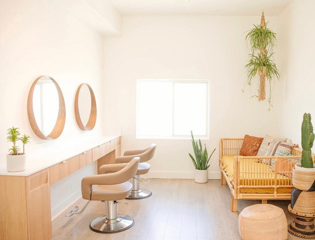 Takara Belmont Knoll styling chairs in a bright salon with oval mirrors